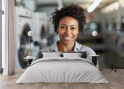 Portrait of young beautiful black businesswoman as owner of the laundromat Wall mural