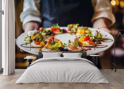 Waiter carrying a plate with delicious vegetarian food on some festive event, party or wedding reception Wall mural