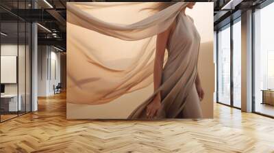 Woman in a long dress walking in the desert with flowing fabric in the wind Wall mural