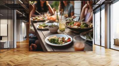 Young and happy people having festive lunch at the beautifully decorated table with healthy food in the garden	 Wall mural