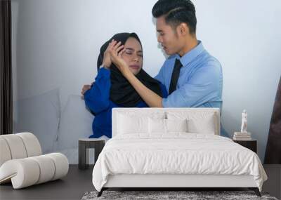 Muslim husband comforting his sick wife on the bed. Health care concept. Wall mural