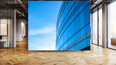 Building exterior with bright blue sky background Wall mural