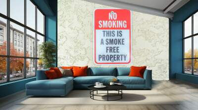 Close-up of a No smoking sign on a textured beige wall at Carlsbad, San Diego, California Wall mural