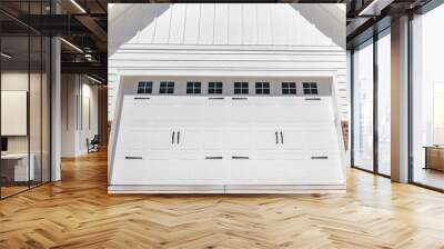 Panorama White puffy clouds Exterior of a garage with white wood and red bricks siding Wall mural