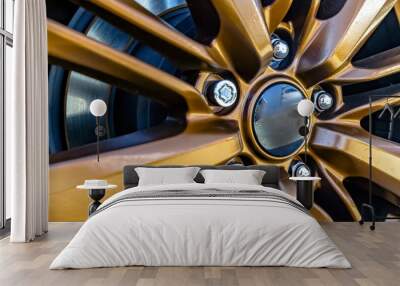 Rim of a car wheel with golden spokes Wall mural