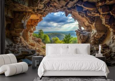 rock cave cavern inside view with bright view outside Wall mural