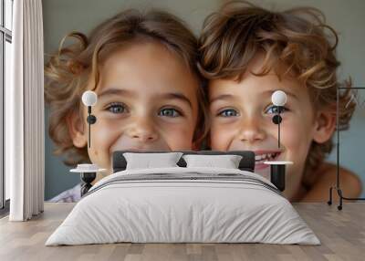 Smiling Young Siblings Embracing Indoors with Bright Eyes and Curly Hair Wall mural