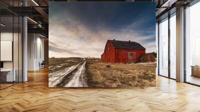 Stunning dramatic sunsets in rural farm country with barns and cold fields with rainbow. Wall mural