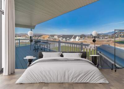 View deck of a house with wooden planks flooring and two barbecue grillers Wall mural