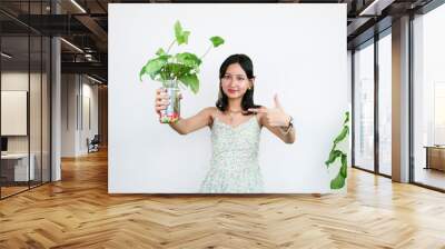 Young Asian Female Gardener Florist With Indoor Garden Plants Wall mural