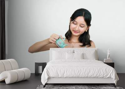 Young Asian girl drinking green tea from a Chinese teapot Wall mural