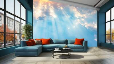 Besutiful ray of sunlight breaking through clouds at sunset. Wall mural