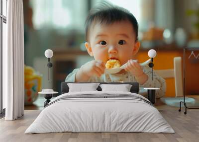 Happy infant baby eats itself Wall mural