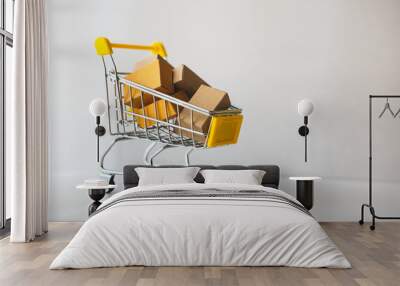 Mini shopping cart contain paper box using as e-commerce, online shopping and business marketing concept Wall mural