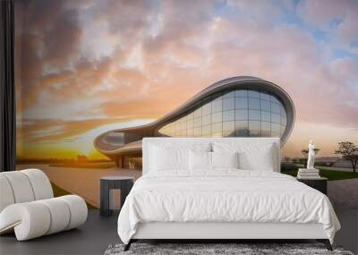 Modern and futuristic building at sunset Wall mural