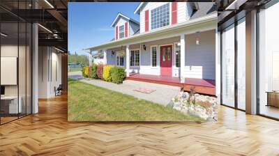 Cute home exterior with red shutters on a summer day. Wall mural