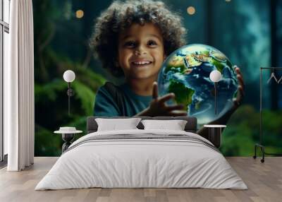 Child holds an illuminated globe and smiles with hope and innocence Wall mural