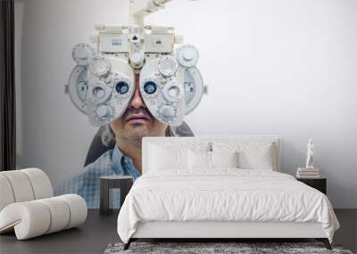 Optometrist eyesight exam, man patient in optician office.Copy space Wall mural