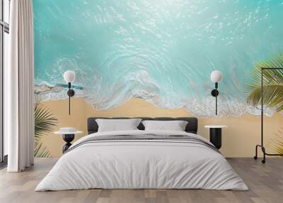 Minimalist beach with clear blue sky gentle waves and palm frond framing the scene Wall mural