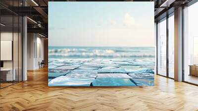 Mosaic tabletop featuring a blurred seaside backdrop with soft blues and calm waves Wall mural