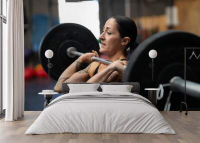 Bodybuilder working out in a cross training center Wall mural