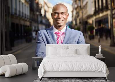 handsome black man wearing suit in urban background Wall mural