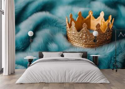 Elegant golden crown on a soft teal fur background, isolated scene for royalty theme. Wall mural