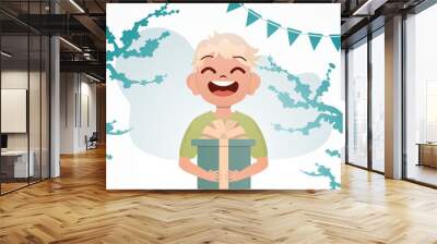 Smiling preschool boy holding a box with a bow. Birthday. Cartoon style. Wall mural