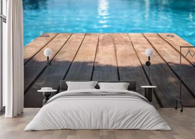 A wooden dock in front of swimming pool with beautiful design Wall mural