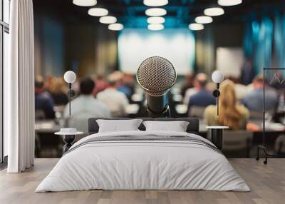 Microphone stands amidst blurred seminar room, speakers voice symbolized Wall mural