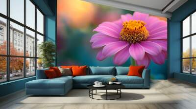 A close-up view of a vibrant pink flower in a lush garden during early morning light amid colorful blooms Wall mural