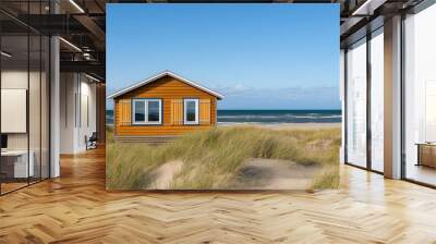 Cozy beach cabin with wooden shutters, nestled among sand dunes and seagrass   rustic beach home, coastal simplicity Wall mural