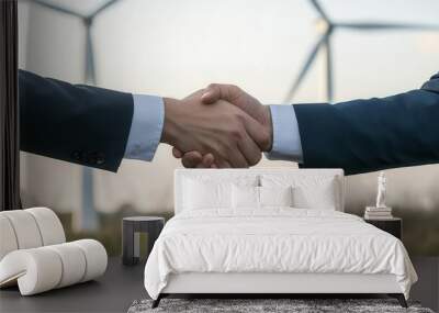 Handshake between two executives in front of wind turbines, symbolizing a sustainable business partnership   green energy, business collaboration Wall mural