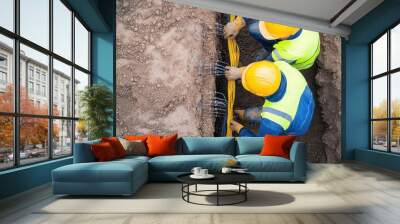 Workers laying electrical cables at a construction site, simple and clean, neutral colors Wall mural