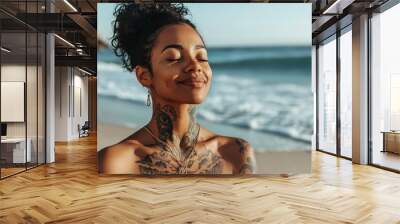 african american woman with tatoos, happy and meditation with breathing on beach for fresh air or spiritual yoga in nature. Faith, person or peaceful by ocean for sunset worship, holistic mindset or z Wall mural