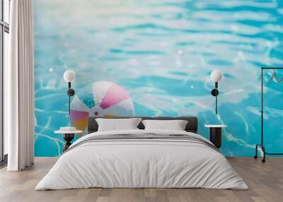 Summer holidays background with colorful beach ball floating on luxury swimming pool and copy space Wall mural