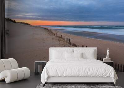 Beautiful sunset at Outer Banks beach viewing from Jennette's Pier, Nags Head, North Carolina, USA. Wall mural