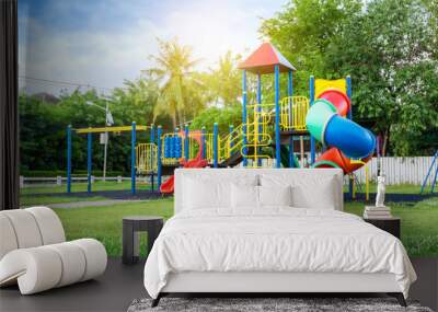 Colorful playground on yard in the park. Wall mural