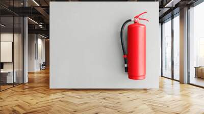 Fire extinguisher on the gray wall Wall mural