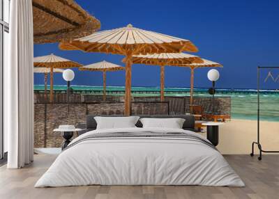 Egyptian parasol on the beach of Red Sea. Marsa Alam, Egypt. Wall mural