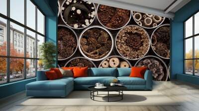 Insect house -hotel, made of used coffee cans and various wooden and plants parts Wall mural