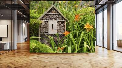 Insect house - hotel in a summer garden Wall mural