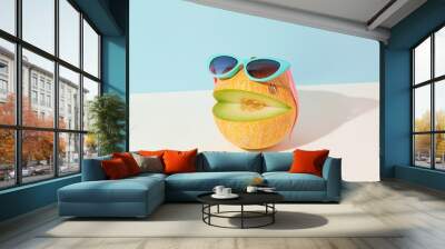 Abstract creative summer fruit scene made of cut melon with sunglasses on isolated pastel blue and beige background. Sun and shadow. The idea of happy emoticon. Ocean beach party or vacation concept. Wall mural