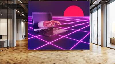 Red, glowing sun and male hands from laptop screen type on keyboard. Remote work, online education or social networks idea. Minimal vaporwave abstract scene on purple background with neon grid. Wall mural