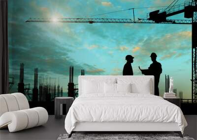 Silhouette images of construction sites are underway and workers are working Wall mural