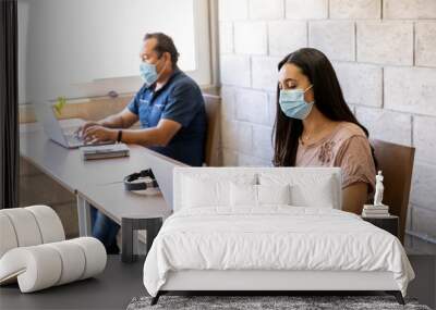 Workers doing office work on computers with social distance Wall mural