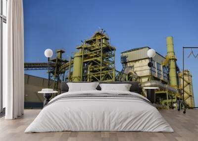 Industrial building against blue sky Wall mural