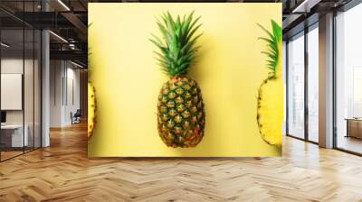 Bright pineapple pattern for minimal style. Top View. Pop art design, creative concept. Copy Space. Fresh pineapples on yellow background. Wall mural