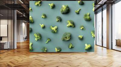 Creative layout of fresh broccoli on green paper background. Top view. Food pattern in minimal style. Flat lay. Banner Wall mural