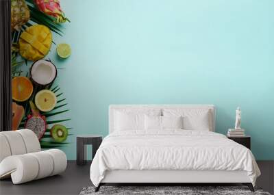 exotic fruits and tropical palm leaves on pastel turquoise background - papaya, mango, pineapple, ba Wall mural